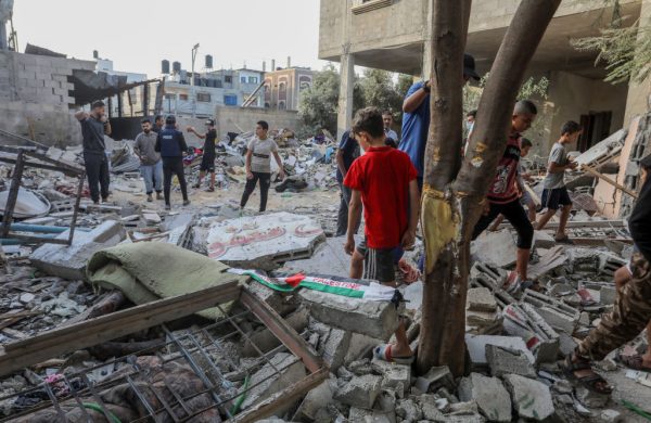 RAFAH, GAZA - OCTOBER 30: Palestinians collect usable items from the rubble of the partially collapsed house as Israeli attacks continue to cause destruction on the 24th day in Rafah, Gaza on October 30, 2023. (Photo by Abed Rahim Khatib/Anadolu via Getty Images)